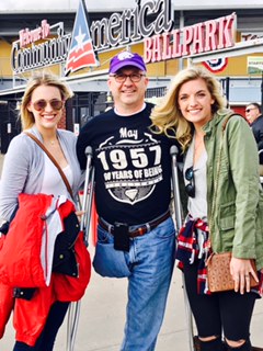 Greg and his daughters at Community America Ball Park in May 2017 for his 60th birthday party.