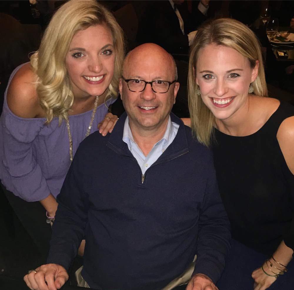 Greg and his daughters celebrating his 60th birthday dinner.